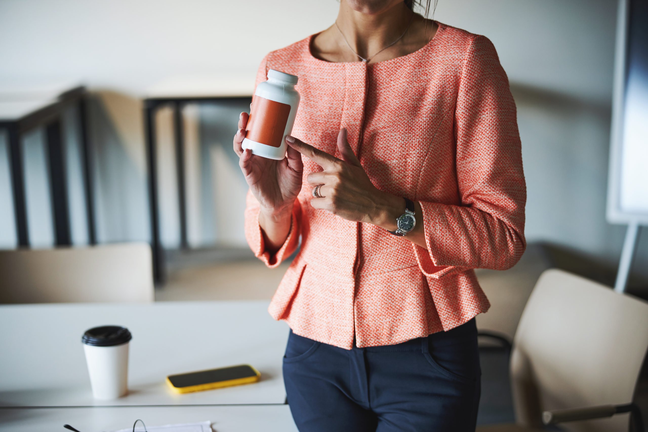 business lady showing organic vitamin